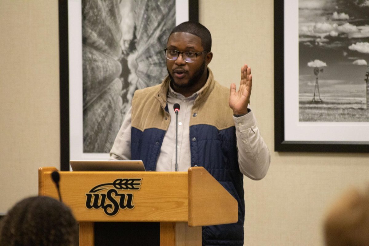 Brandon McClain speaks in a Student Government Association meeting on December 6 (File photo).