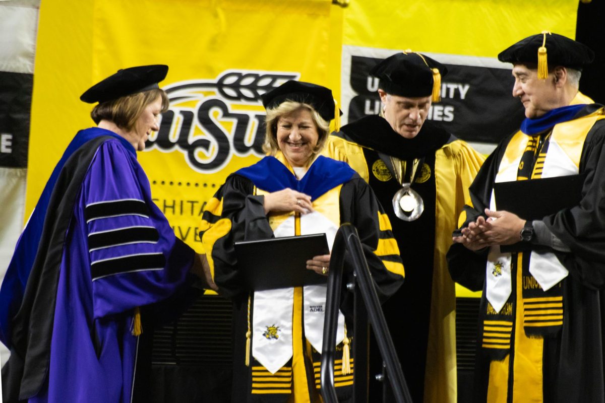 Yolanda Camarena receives an honorary doctorate from Wichita State at the fall 2023 graduation commencement ceremony on Dec. 17. Camarena and her husband, Gene, were both awarded this honor.