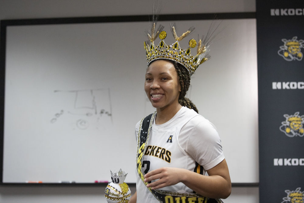 Redshirt senior TreZure Jobe smiles in a crown, given to her by head mens basketball coach Terry Nooner. Jobe was awarded it for her efforts on the court against Tulane University on Dec. 30.