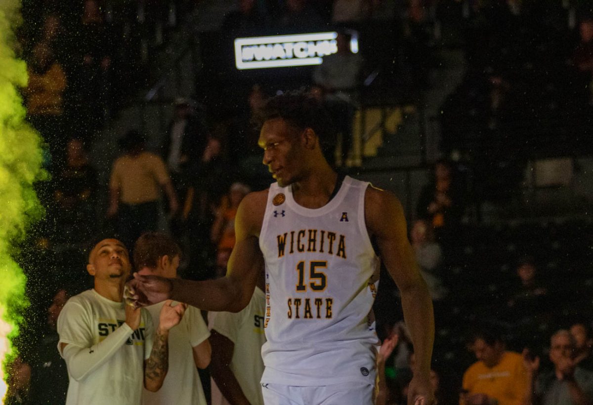 Quincy Ballard, a juninor basketball player at Wichita State University, walks onto the court as his name is announced. Ballard scored four points for the team on Jan. 28.