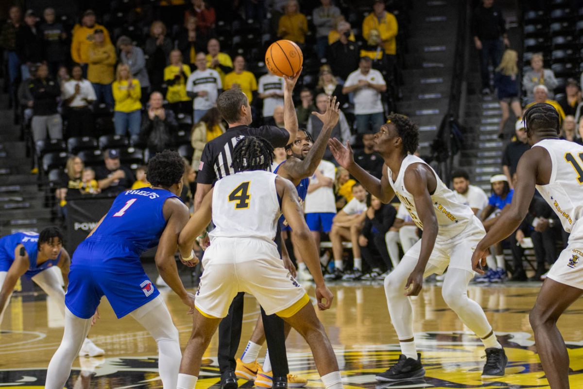 Wichita State basketball players get ready for the jumpball during the game against Southern Methodist University on Jan. 28.
