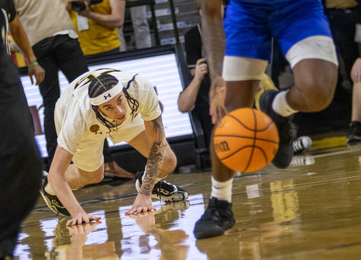 Bijan Cortes gets up to chase a loose ball during the game against Southern Methodist University. Cortes scored seven points during his 16 minutes on court.
