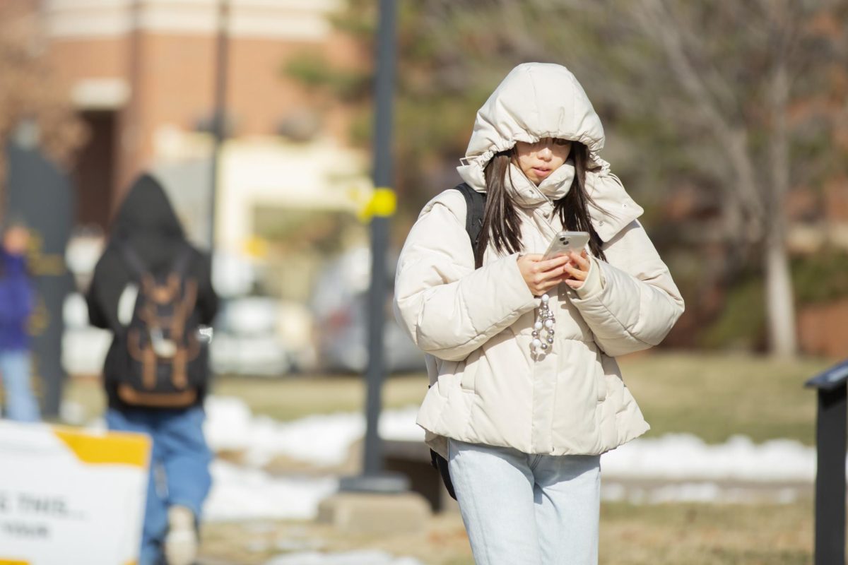 Natsuki Doi, a student at Wichita State, walks through campus on the first in-person day back to school. Wednesday, Jan. 17 was a cool 30 degrees Fahrenheit most of the afternoon.