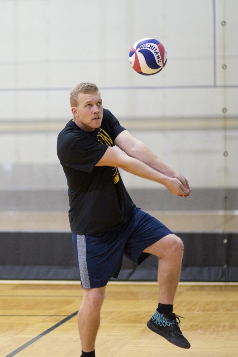 Wesley Horner, president of the recreational mens volleyball team at Wichita State, prepares to volley the ball at the Heskett Center on Jan. 30.