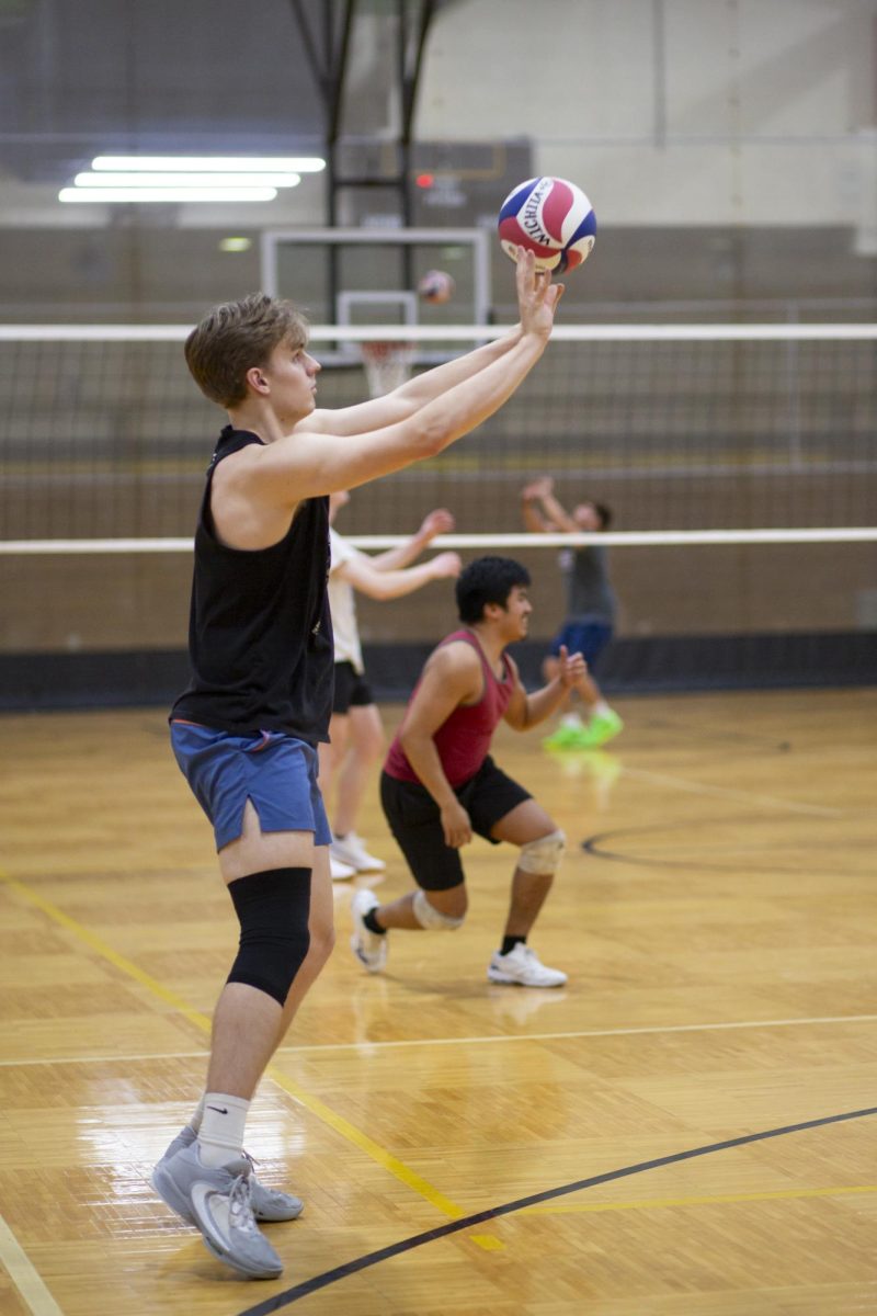 Zach Oakley, a member of the recreational mens volleyball team at Wichita State, volleys the ball during practice on Jan. 30 in the Heskett Center.