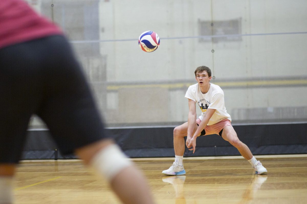Owen Landis, a member of the recreational mens volleyball team at Wichita State, gets ready to volley the ball during practice in the Heskett Center on Jan. 30.