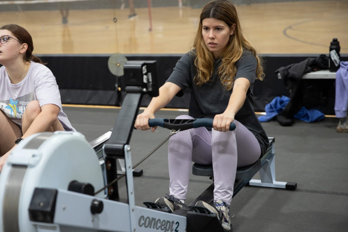 Industrial engineering student Jaeza Robertson exercises on the ergometer machine for rowing team practice. The Wichita State rowing team practices on the ergometer machine on Tuesdays and Thursdays in the Heskett Center.