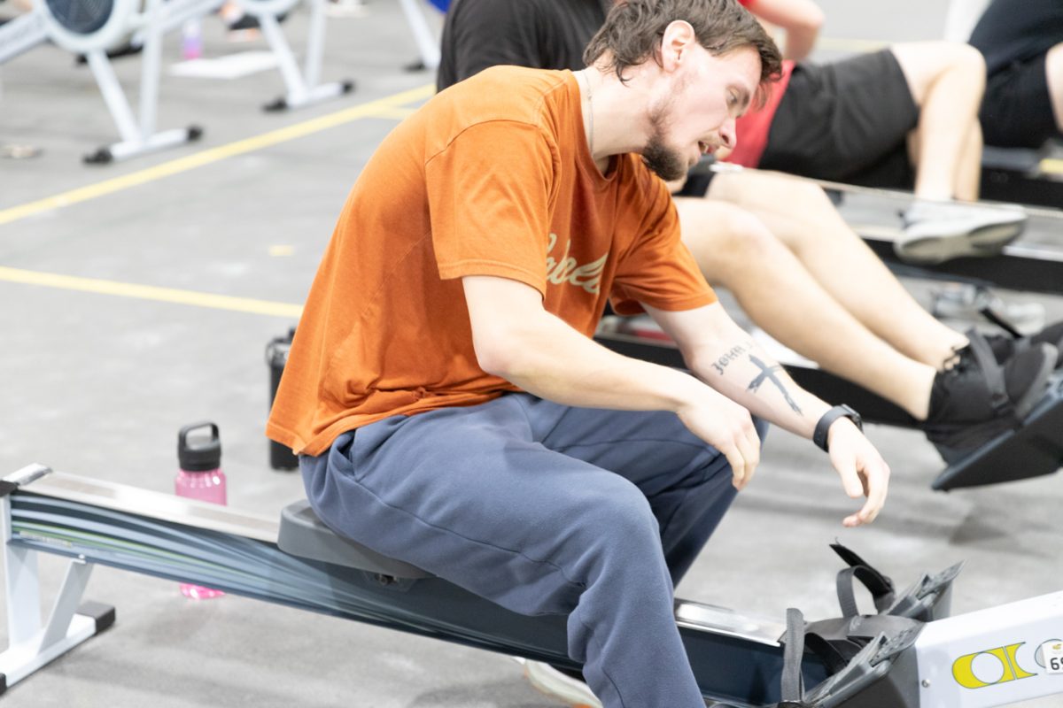 Exercise science major Landon Moore recovers from a workout at rowing team practice. The Wichita State rowing team practices on ergometer rowing machines on Tuesdays and Thursdays.