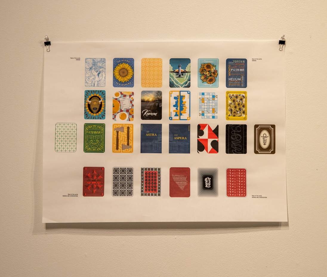 The image above shows a deck of cards from the new exhibition Wichita/Sarajevo Connection Stories. The student who created them is from Bosnia and displays the front and back of the cards.