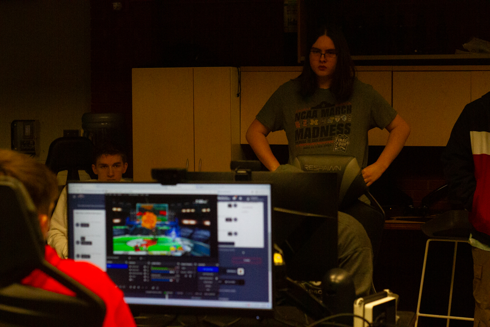 Sean Fontes watches a member of WSU's varsity esports team compete against Fisher College in "Super Smash Bros."