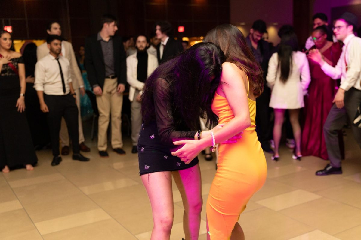 Students dance together in a dance circle at Fairmount Formal on Feb. 2. The annual Fairmount Formal, hosted by the Student Activities Council, was held in Beggs Ballroom and had music, a dance floor, refreshments, and a photo booth for students to enjoy.
