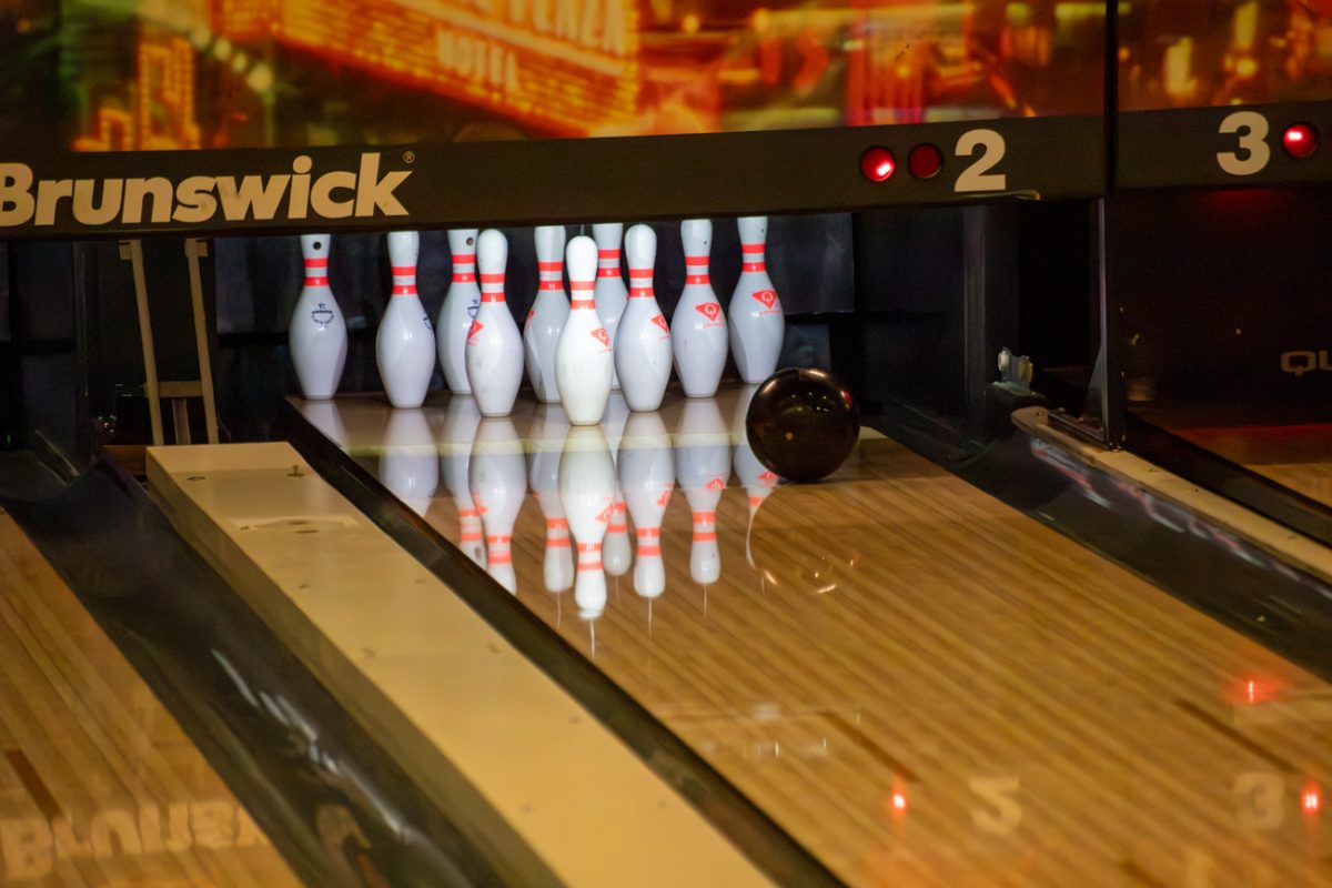 A bowling ball rolls toward pins during a Wednesday afternoon practice on Feb. 21.