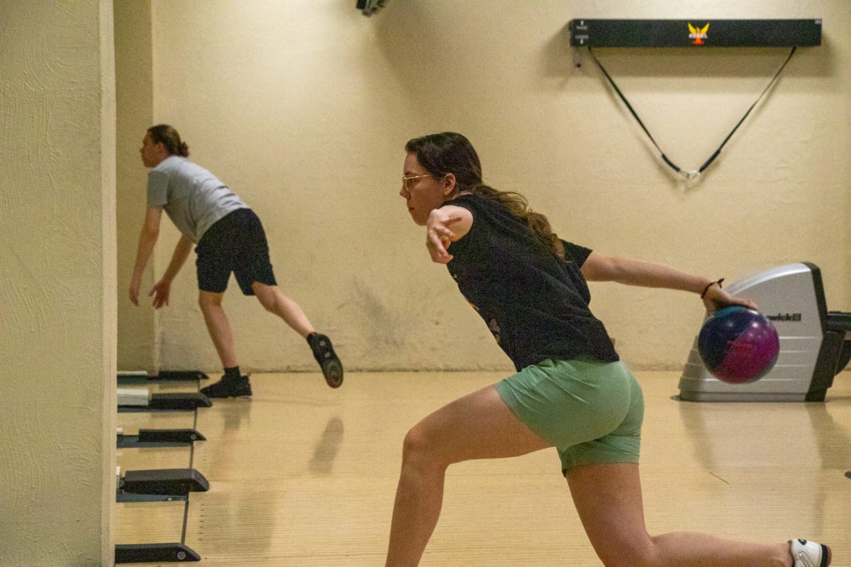 Chloe Ciecko, a game design senior at WSU, throws a bowling ball during practice at the bowling lanes in the RSC. Ciecko began her collegiate bowling career on the developmental team, before being promoted to the selected team for the last two seasons.