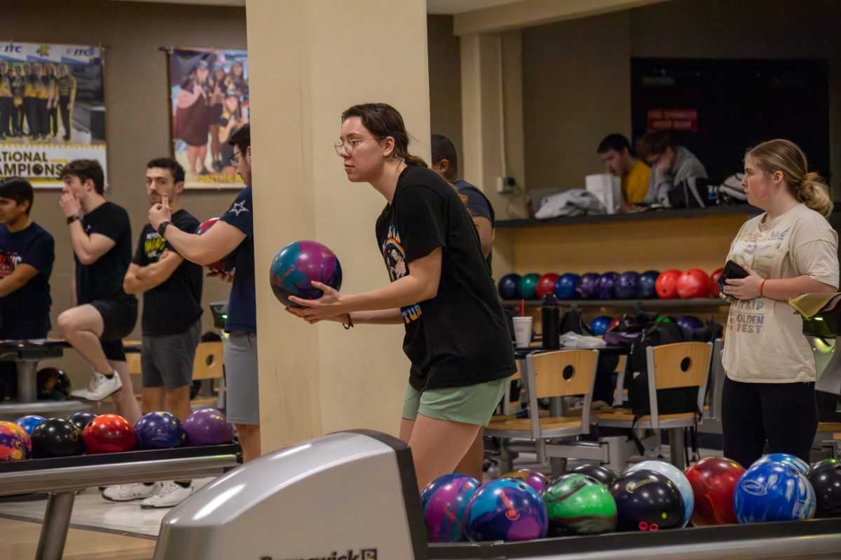 Chloe Ciecko, a member of the womens bowling team at WSU, sets up for her approach. Her high game is 279 and her high series is 740.