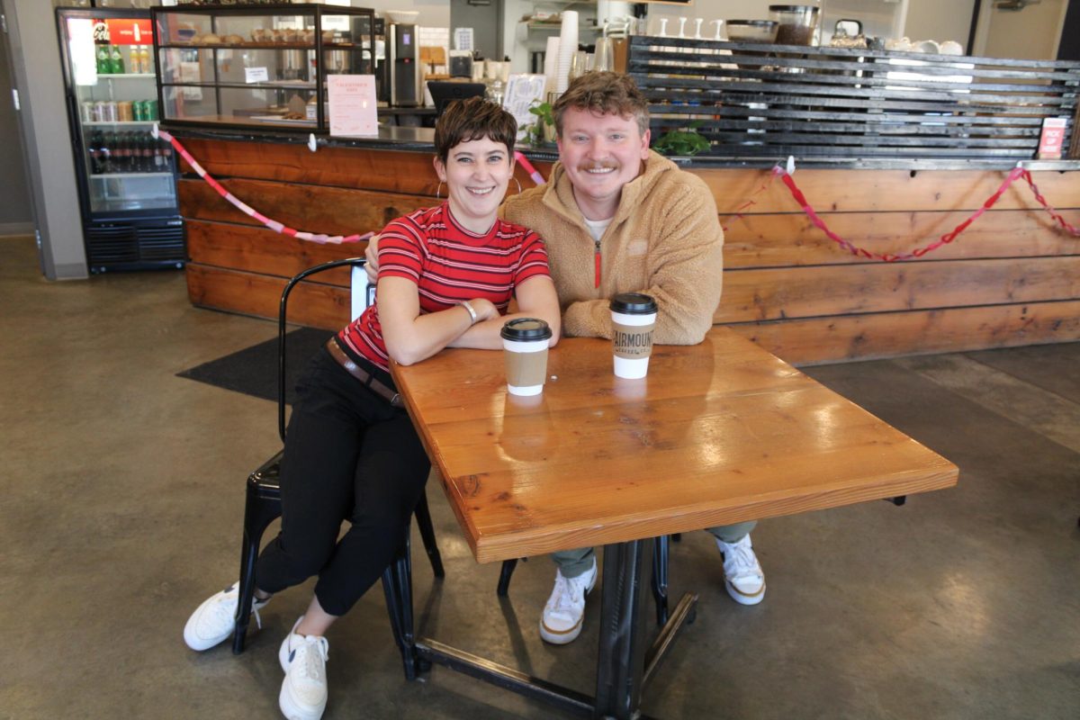 Ellen Mosiman and Dustin Youngman pose for a photo at Fairmount Coffee Co. Mosiman and Youngman were graphic design majors at Wichita State and have continued working in the industry.