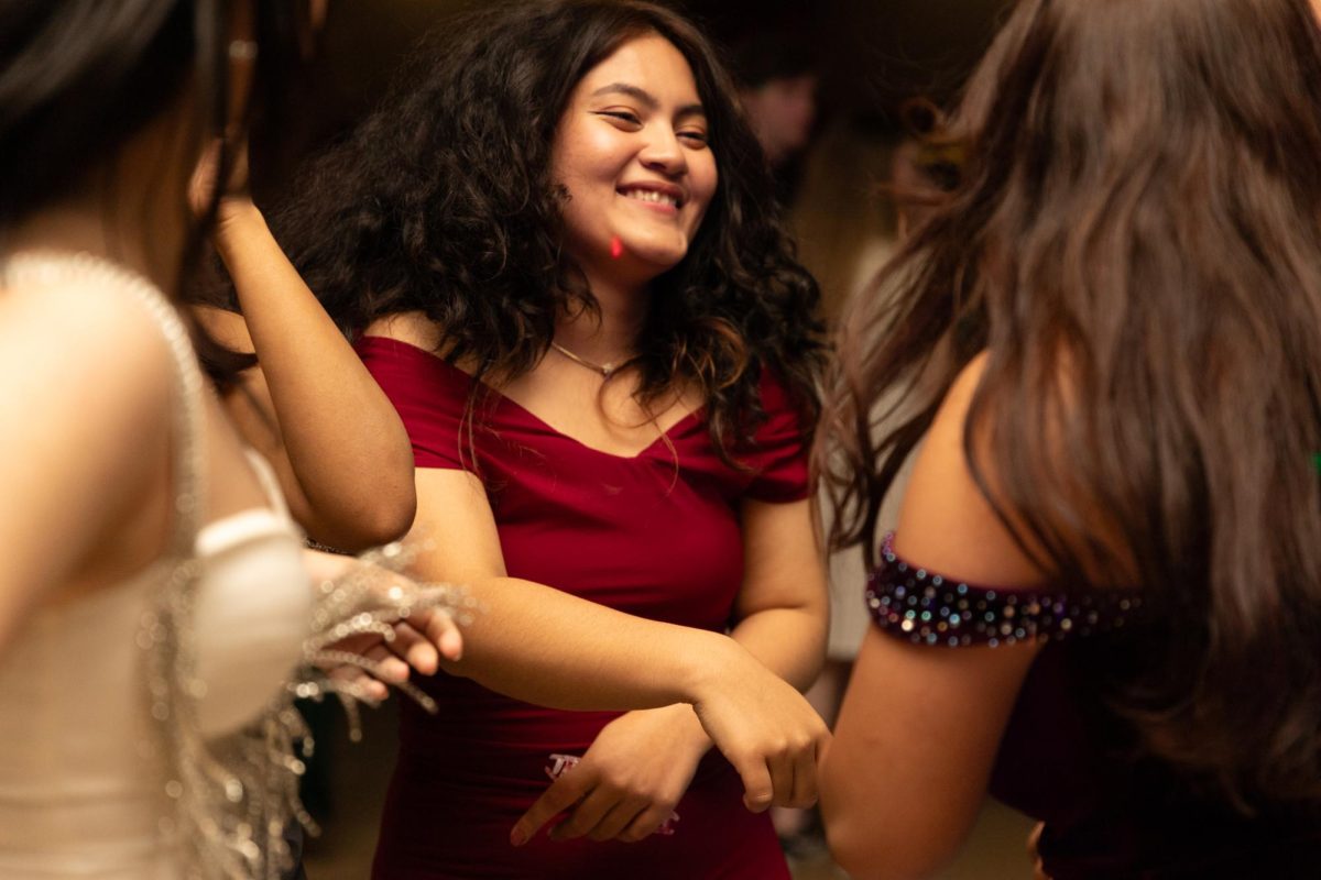 A group of students dance at the Fairmount Formal on Feb. 2. The annual Fairmount Formal, hosted by the Student Activities Council, was held in Beggs Ballroom and had music, a dance floor, refreshments, and a photo booth for students to enjoy.