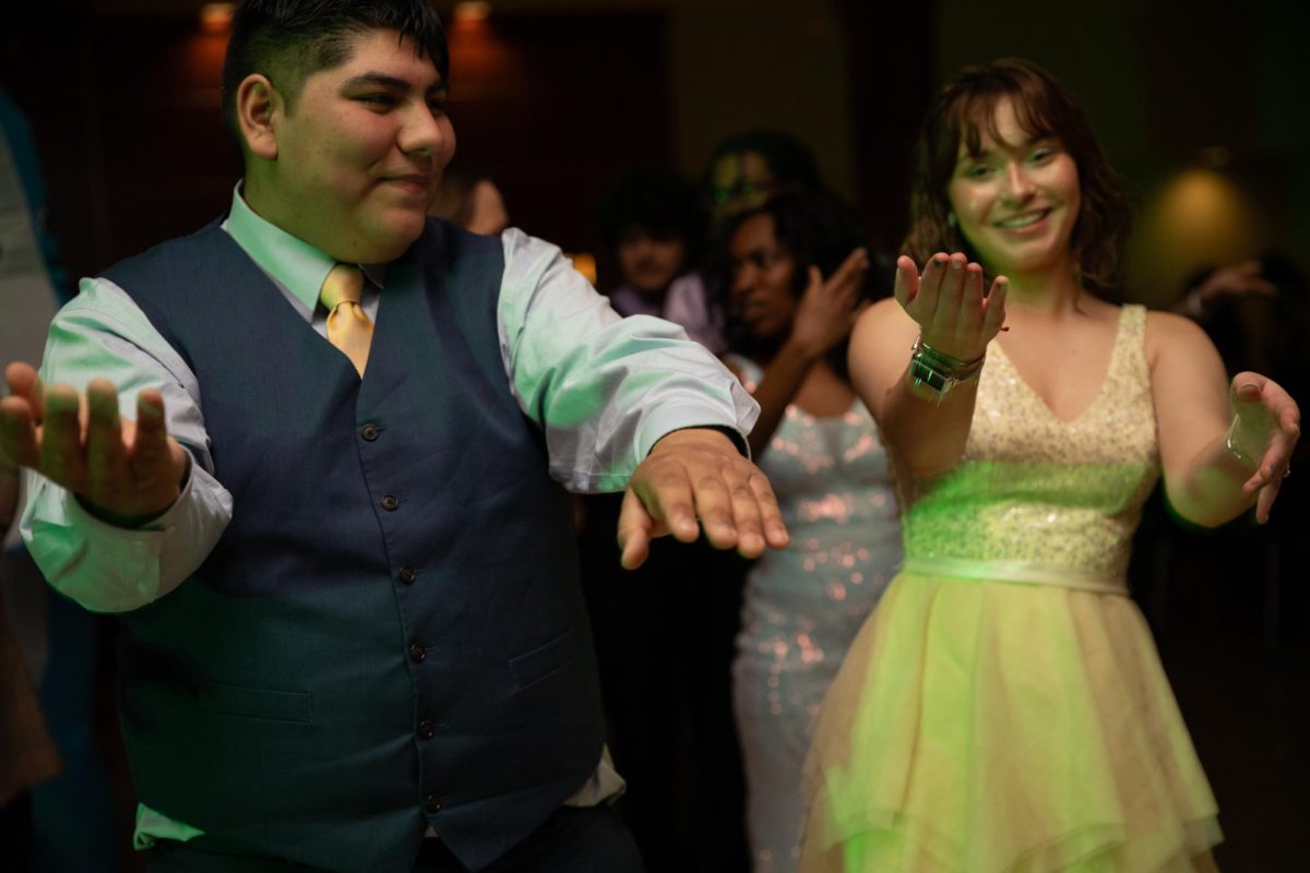 Students do the macarena dance at the Fairmount Formal on Feb 2. The annual Fairmount Formal, hosted by the Student Activities Council, was held in Beggs Ballroom and had music, a dance floor, refreshments, and a photo booth for students to enjoy.