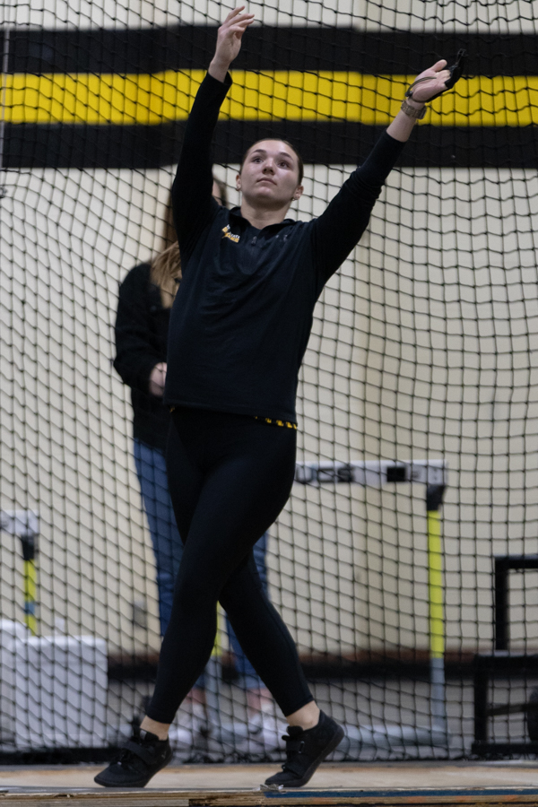 Junior Samantha Marx competes in the weight throw at the Wilson Invitational meet on Jan. 26. Marxs best throw of the meet was 44.