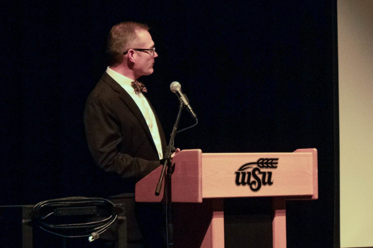 Jeffrey Jarman, dean of the Elliott School of Communication, speaks at the screening of the Unwarranted documentary at Wichita State. Jarman moderated a panel, which discussed the documentarys creation.
