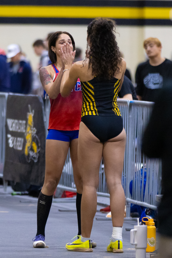 Freshman Sonya Haylor has a moment with Hutchinson Community College freshman Brooke Hawkins. Hawkins placed second and Haylor placed fifth in the triple jump.