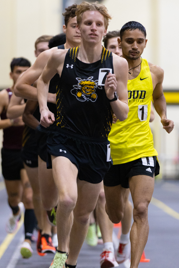 Freshman Bennett Meoli starts his second lap of the mens 5000 meters at the Wilson Invitational on Jan. 26. Meoli placed fifth with a time of 15:35.57.