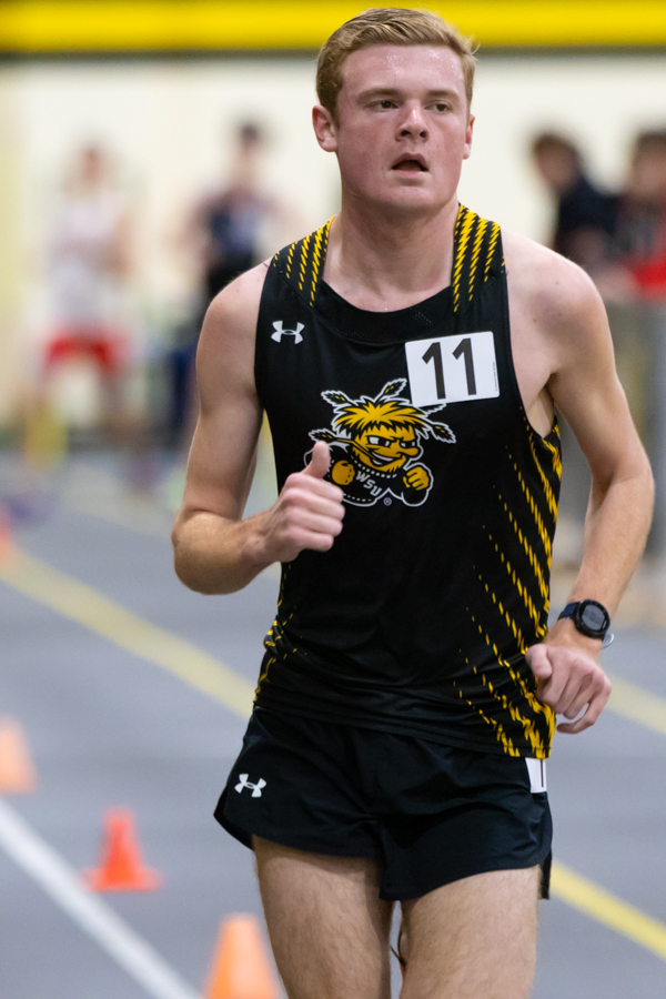 Sophomore Ian Hunter runs in the 5000 meter distance race at the Wilson Invitational in the Heskett Center on Jan. 26. Hunter placed 16th in the event with a time of 16:25.98.