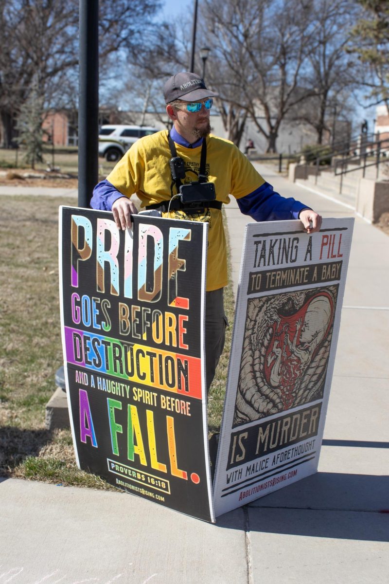 Nicholas Heald protests outside of the Rhatigan Student Center on Tuesday, Feb. 20. My ultimate goal out here is to glorify God, Heald said. And I see that on display today that people are wicked, they need a Savior, Heald said.
