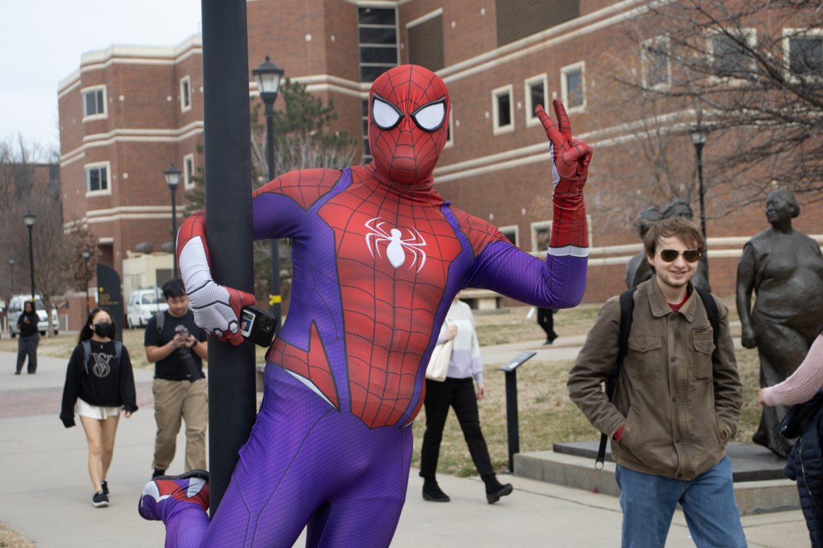 Nicholas Davis, one of the Spidermen of WSU, poses for photos and hands out fist bumps outside of the Rhatigan Student Center on Wednesday afternoon. Davis said he decided to reclaim the spot after anti-abortion and anti-LGBTQ+ activist Nicholas Heald protested at the spot on Tuesday. I want this (interacting positively with students) to serve as a pick-me-up, Davis said Im really out here to make people smile.