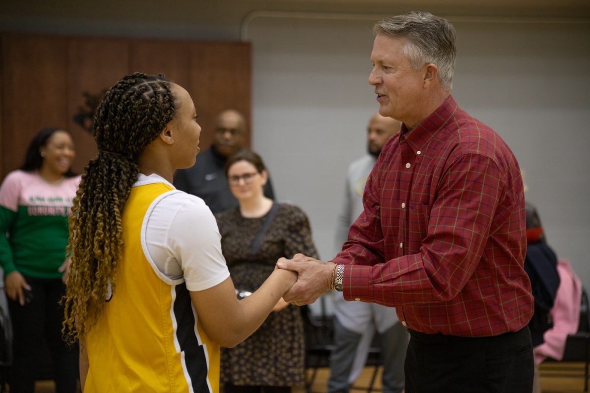 Sen. Roger Marshall talks to the TreZure Jobe, a player on the womens basketball team at Wichita State. Marshall visited the university on Feb. 19 to give the team words of advice.