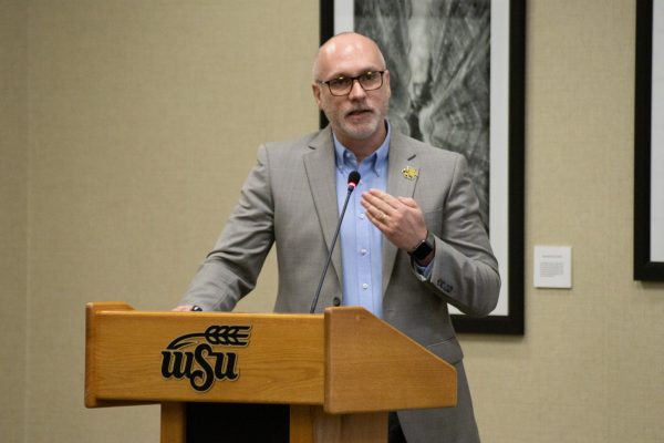 David Miller, the university budget director, presents an outline of how the university takes in and distributes funds to the Student Government Association on Feb. 7. Miller also spoke about Wichita States financial “challenge” regarding international graduate students.