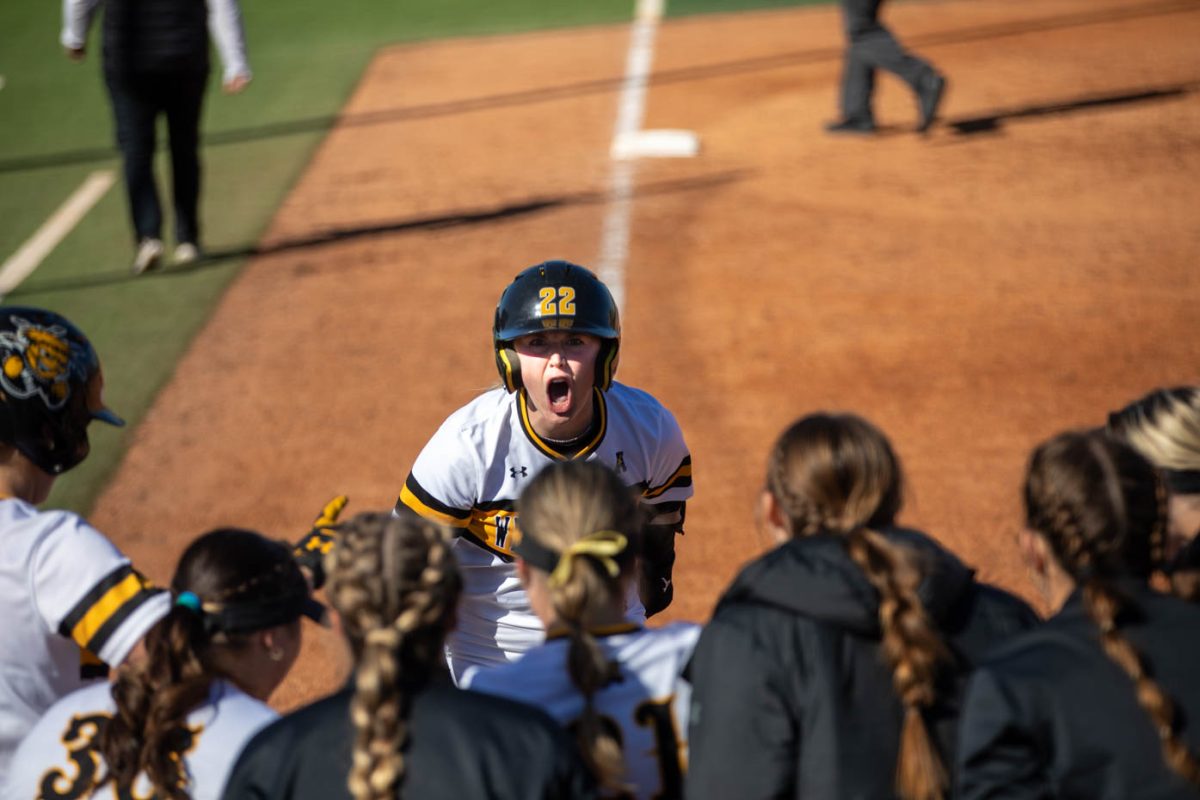 Lainee Brown screams on her way to home plate after hitting a home run against Florida Atlantic on March 9.