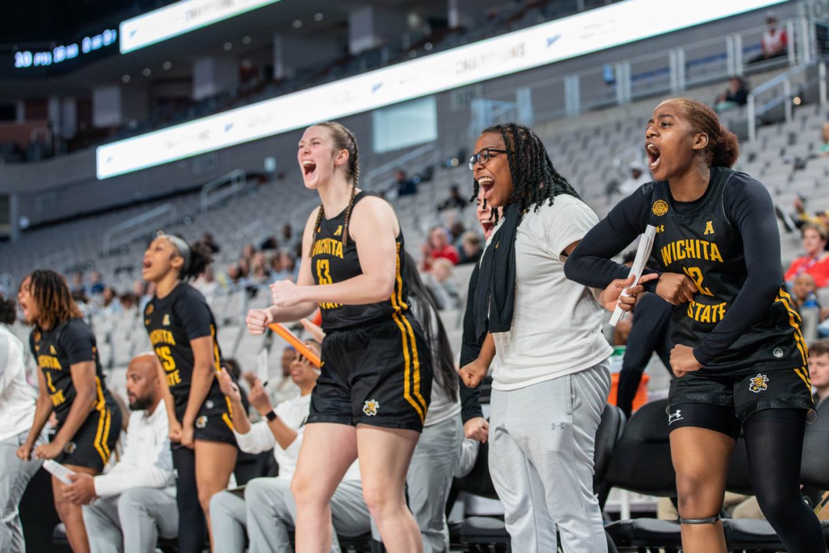 The+Shockers+celebrate+on+the+sidelines+following+a+Wichita+State+basket+during+the+AAC+tournament.
