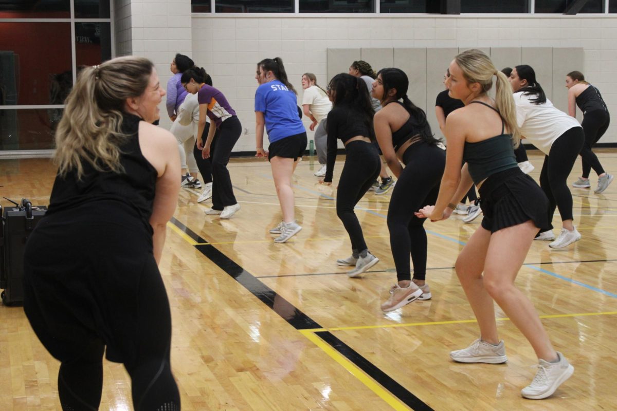 Charis Weldon leads her Tuesday night Zumba dance. Weldon said she hopes to create a welcoming environment in the class even for those new to the gym.