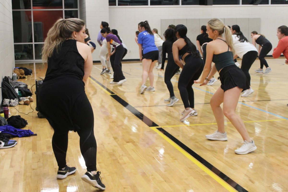 Charis Weldon leads her Tuesday night Zumba dance. Weldon said she hopes to create a welcoming environment in the class even for those new to the gym.