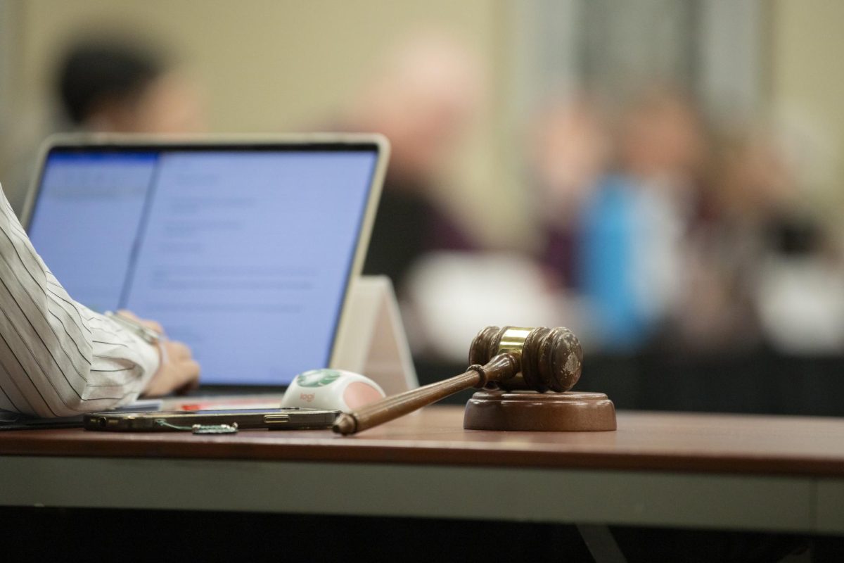 Jia Wen Wangs gavel lies on the table as the Student Fees Committee Hearings take place on March 4. Wang serves as the student body treasurer for the Student Government Association.