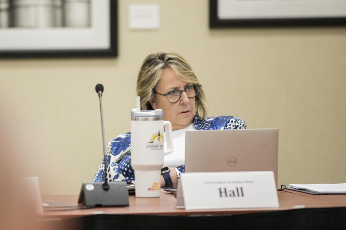 Teri Hall, vice president for student affairs, listens to a a group present during the Student Fees Committee Hearings on March 4.