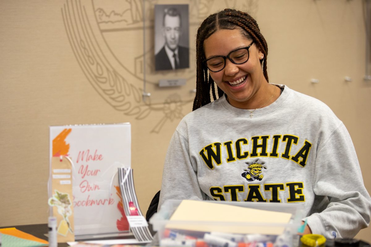 Kyla Gordon laughs while making bookmarks at the Influential Women in Literature event. The event was hosted by Office of Diversity and Inclusion and the ShelfCare Book Club for International Womens Day on March 8.