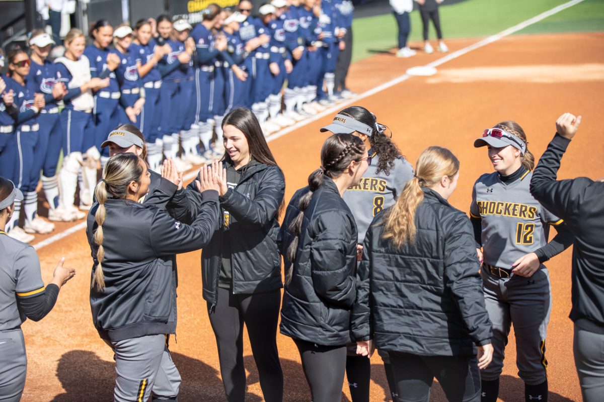 Wichita State softball players hype each other up before the game against Florida Atlantic on March 9 in Wilkins Stadium.
