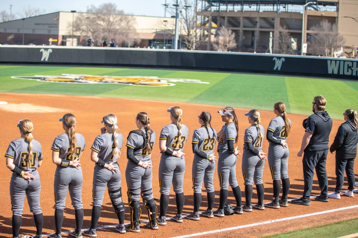The Wichita State softball team during the national anthem at the Wilkins Stadium on March 10.