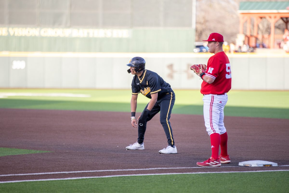 A Wichita State baseball player  waits at first base during a game against Nebraska on March 12.