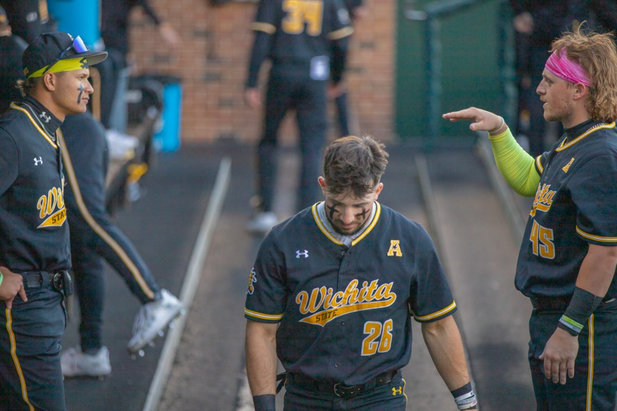 Derek Williams walks along the dugout at Eck Stadium on March 12. Wichita State hosted the Nebraska Cornhuskers in a two-game series.