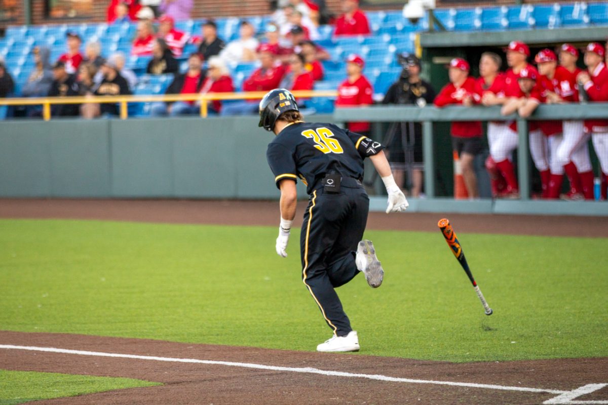 Camden Johnson, a freshman, throws his bat during a game against Nebraska on March 12.