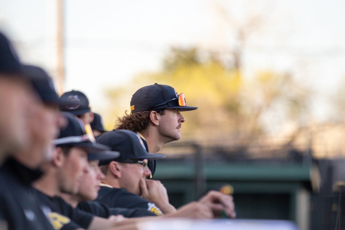 The Wichita State baseball team watches the game against Nebraska from the dugout on March 12.