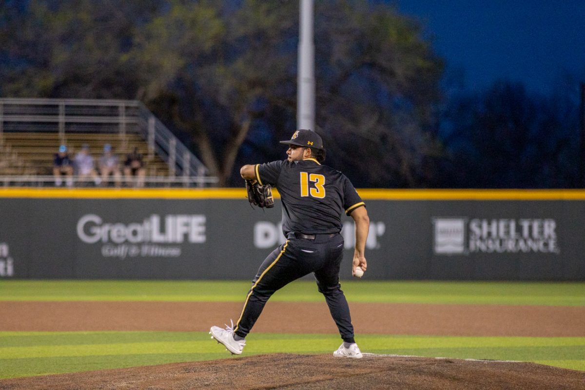 Ronald Zayas, a right-handed pitcher, pitches the ball on March 12 in the first of two games against Nebraska.