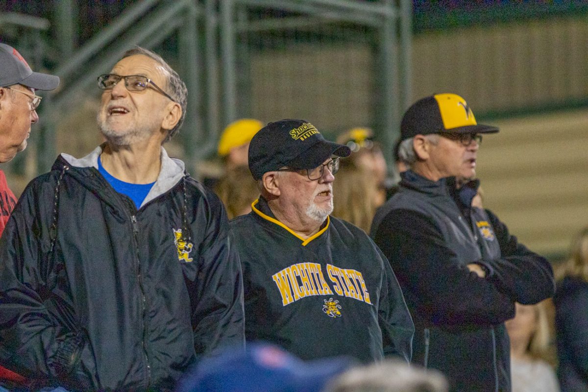 Wichita State fans watch baseball play against Nebraska in the evening on March 12.