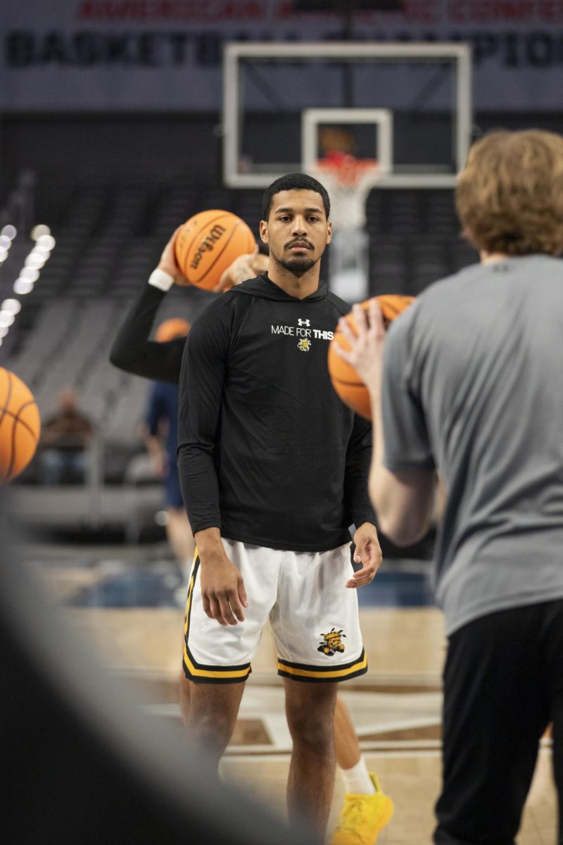 Redshirt junior guard Harlond Beverly looks to the ball during warmup before the game against Rice University. Wichita State won, 88-81, progressing the Shockers to the second round of the AAC in Fort Worth, Texas.