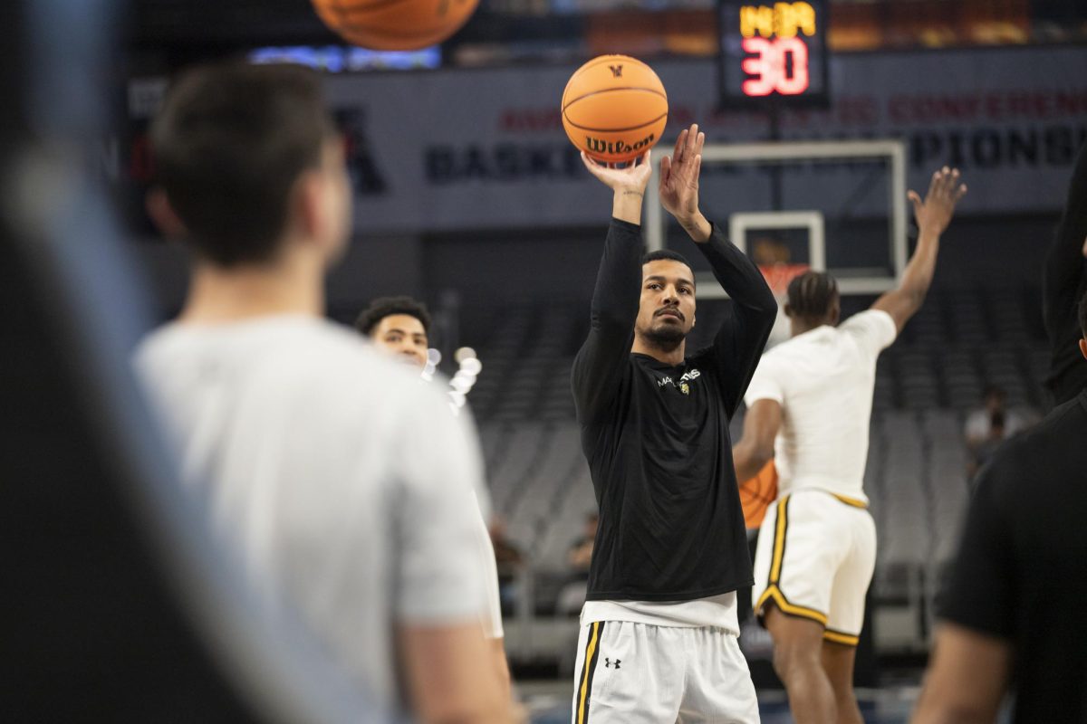 Redshirt junior guard Harlond Beverly prepares to shoot the ball during warmup before the game against Rice University. Wichita State won, 88-81, progressing the Shockers to the second round of the AAC in Fort Worth, Texas.