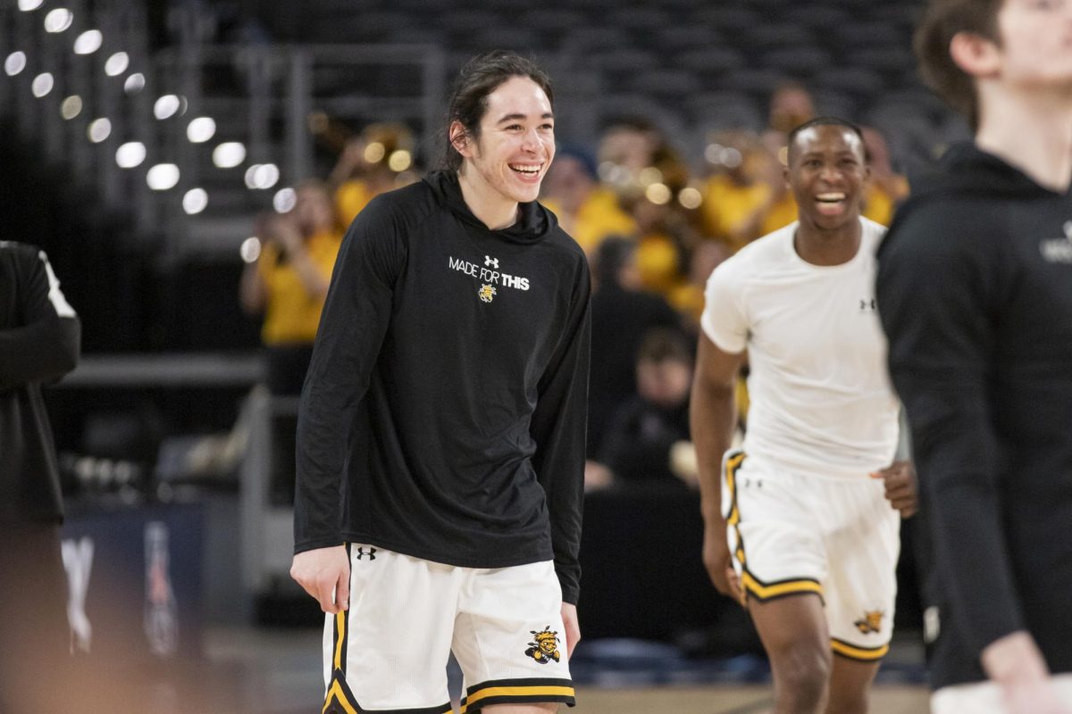 Junior guard Bijan Cortes and freshman guard Joy Ighovodja laugh during warmup before the match against Rice University in Dickies Arena. The 88-81 win on March 13 took the Shockers to the second round of the AAC.