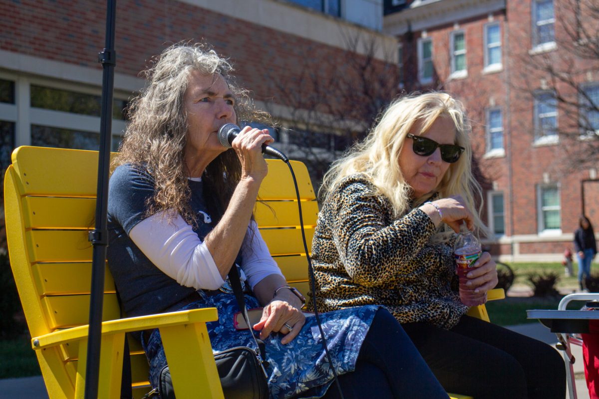 Sister Cindy sits alongside Sister Kathy while preaching to students on Tuesday afternoon. The duo spoke in front of Wichita State students March 19-21 about Christianity, immorality and how to not be a hoe.