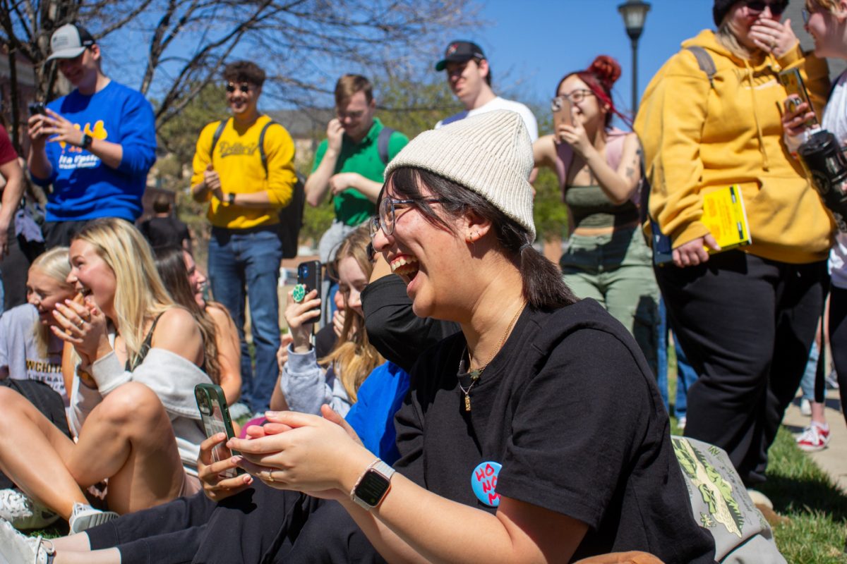 Enrich Patdu laughs as Sister Cindy preaches to WSU students during Tuesdays sermon. More than 50 students gathered to listen to the TikTok sensation speak about her Ho No Mo Revolution.